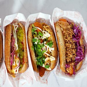 3 types of carrot hot dogs in wrapper.