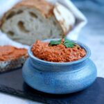 blue bowl with spread and loaf.